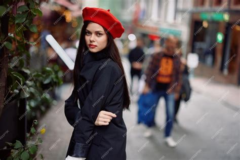 Premium Photo | Woman walking down an old city street in a crowd