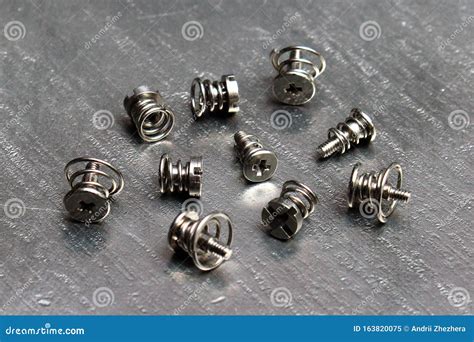 Spring Loaded Screws On Steel Metal Background Stock Image Image Of