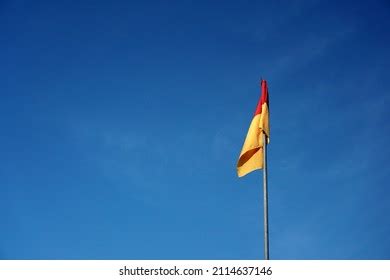 Red Over Yellow Flag Beach Signifies Stock Photo 2114637146 | Shutterstock