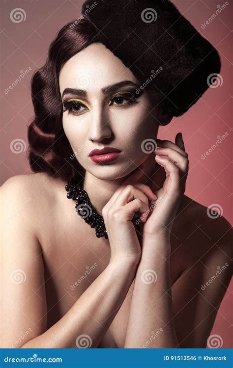 Portrait Of Beautiful Naked Fashion Model With Wavy Hair Style Hat And