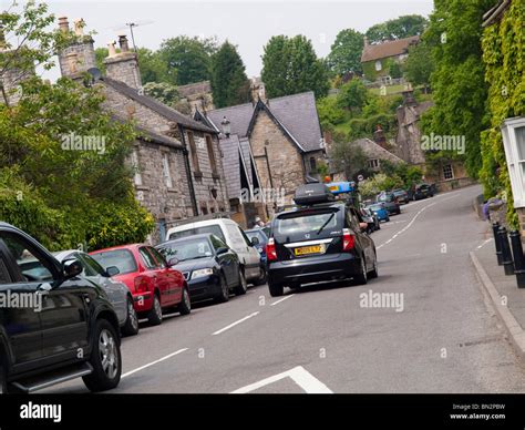 Cars Driving Through A Village In The Peak District Derbyshire England