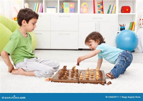 Kids playing chess stock image. Image of healthy, home - 24682971