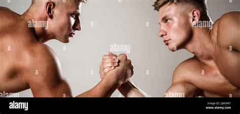 Two Men Arm Wrestling Rivalry Closeup Of Male Arm Wrestling Two