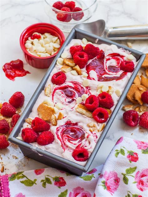 Raspberry And White Chocolate Ice Cream In A Pan With Spoons Next To It