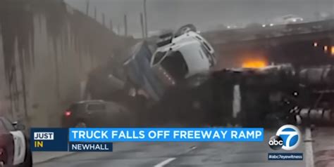 Chaos Ensues When Semi Truck Rolls Off Overpass Onto Another Crash Site