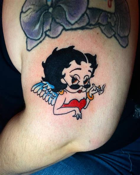 Betty Boop Tattoo Done On The Upper Arm