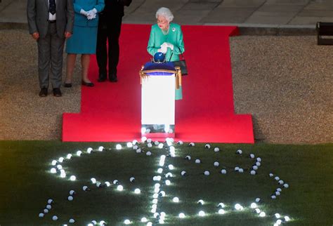 Queen lights platinum jubilee beacon to celebrate 70 years on throne