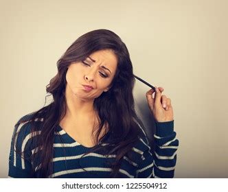 Confusion Grimacing Brunette Woman Thinking Looking Stock Photo Shutterstock