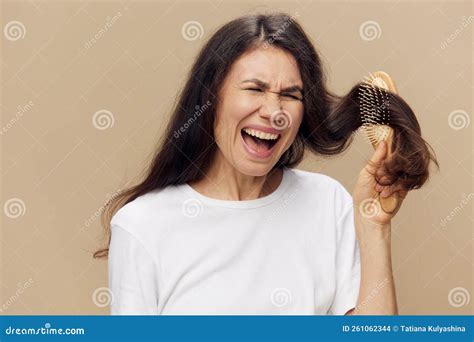 Beautiful Cute Attractive Middle Aged Brunette Combing Her Long Hair