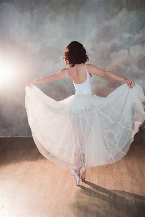 Ballerina In A White Bathing Suit And Of Long Skirt With A Beautiful