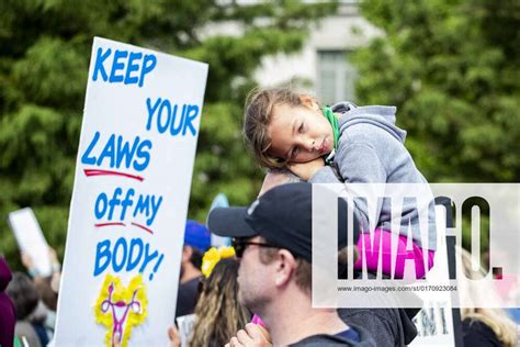 Womens Wave March 2022 Demonstrators Hold Signs During The Womens March