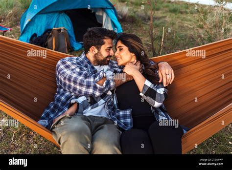 Romantic Couple Relaxing Face To Face In Hammock Stock Photo Alamy