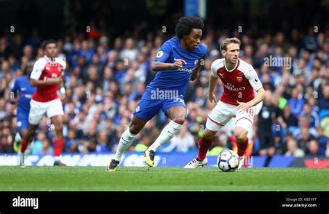 Willian Of Chelsea Cuts Around Nacho Monreal Of Arsenal During The