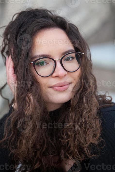 Beautiful Young Woman With Brunette Curly Hair Portrait In Eye Glasses