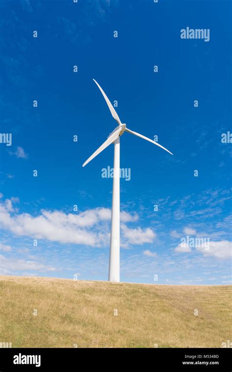 Wind Turbine Against Clear Blue Sky Stock Photo Alamy