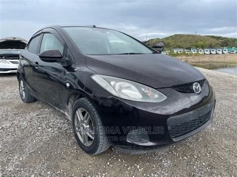 mazda demio  brown  sale vakuboma vehicles limited price tsh