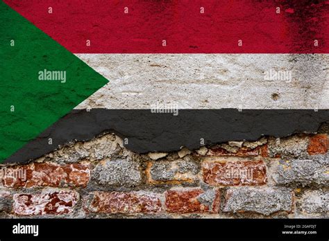 Graphic Concept With A Flag Of Sudan Painted On A Damaged Brick Wall