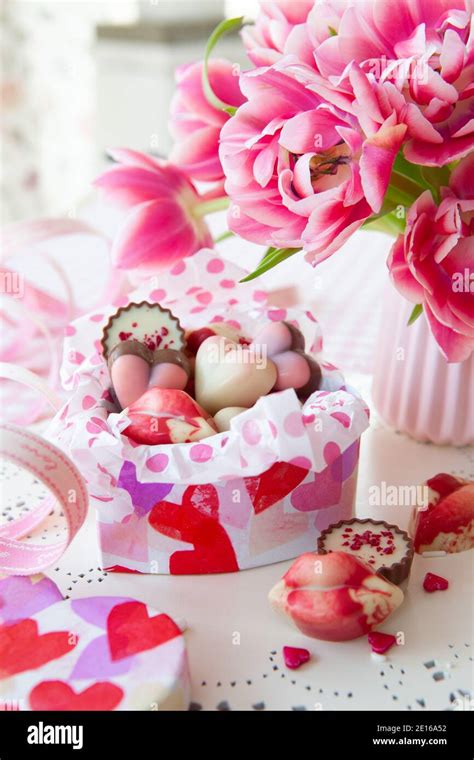 Chocolates And Flowers Stock Photo - Alamy