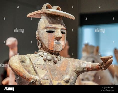 Haniwa Terracotta Tomb Figurine Woman With A Painted Face Offering A