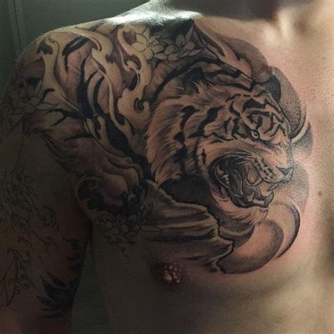 A Man With A Tiger Tattoo On His Chest