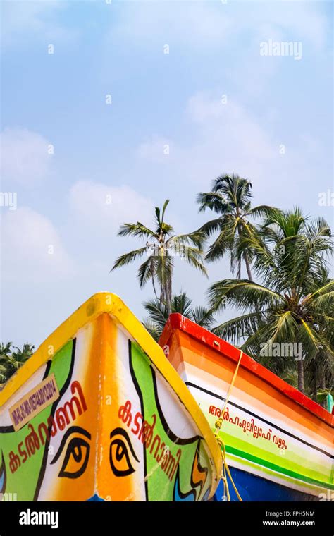 Brightly Painted Fishing Boats On A Beach In Kerala India Stock Photo