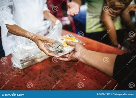 Feeding The Poor To Help Each Other In Society Charity Concept Stock