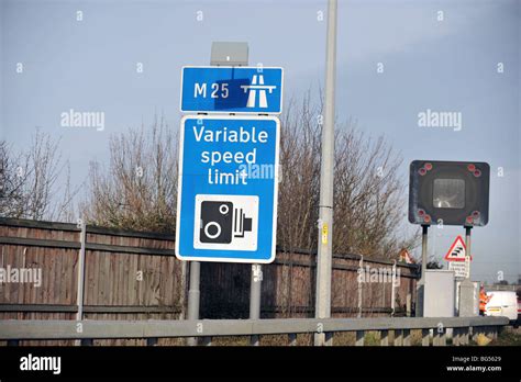 Motorway warning sighn UK M25 variable speed limit Stock Photo - Alamy