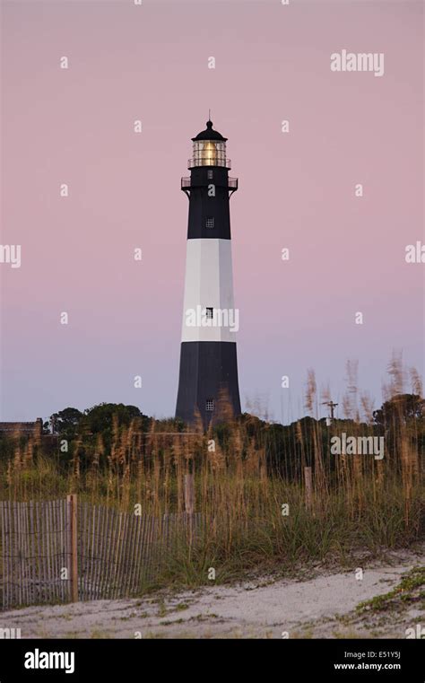 Lighthouse at sunrise Stock Photo - Alamy