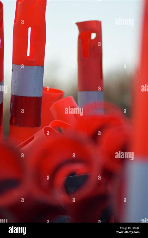 Red Cylinder Traffic Cones Stacked Stock Photo Alamy