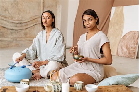 Women Sitting on the Floor while Doing Meditation · Free Stock Photo