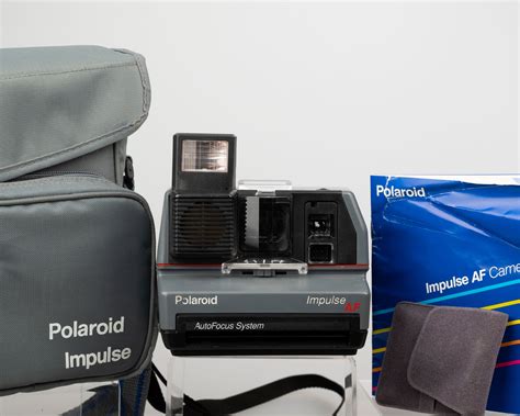 Polaroid Impulse AF instant camera with original case, prism lens filt ...