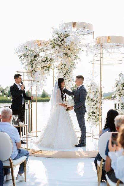 Premium Photo | Wedding ceremony of the newlyweds on the pier