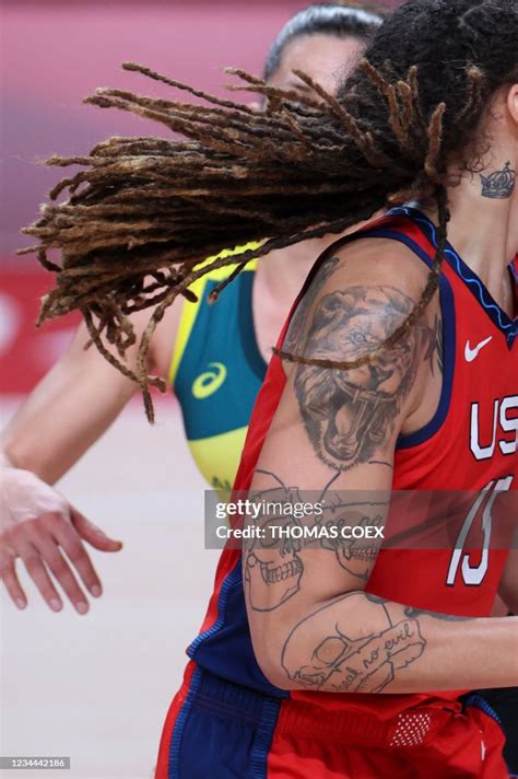 USA's Brittney Griner sports a lion and skulls tattoos on her arm as ...