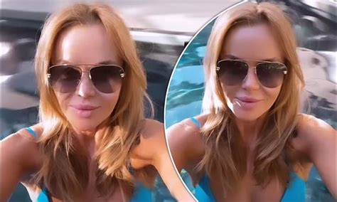 Amanda Holden Appears In A Plunging Blue Bikini As She Poses In The Pool During Her Easter Break