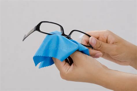 Glasses Cleaning With Fine Microfiber Cloth Women Hand Cleaning Glasses Lens With Blur Green