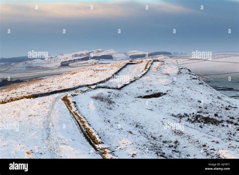 Hadrian S Wall Under A Light Covering Of Snow Looking West Over Caw