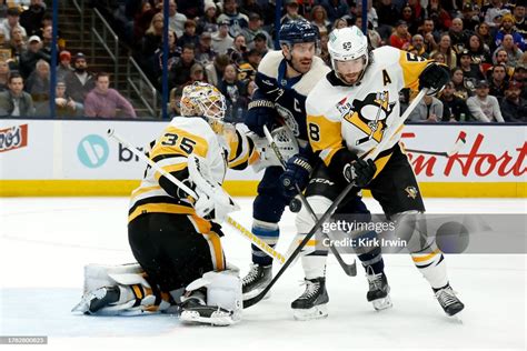 Tristan Jarry Of The Pittsburgh Penguins Makes A Save As Kris Letang