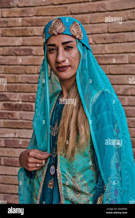 Young baloch woman in traditional clothing, Kerman bazaar, Kerman, Iran ...