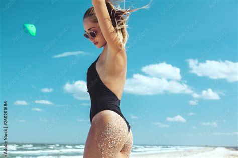 Beautiful Model In Bikini Posing At The Beach Stock Photo Adobe Stock