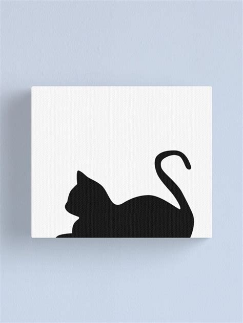 A Black Cat Silhouetted On A White Background With The Tail Curled Up