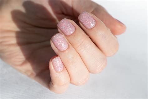 Premium Photo Beautiful Nude Manicure With A Design On Short Square Nails Manicure For Women
