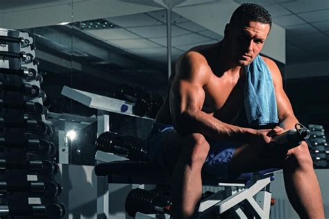 Premium Photo Resting After Training Man In Gym Sporty Male With Naked Torso Workout Guy