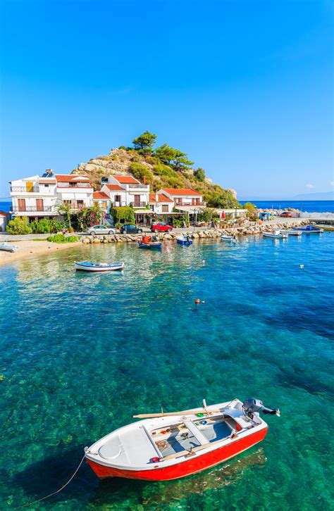 Tiny Fishing Boat At Spectacular Kokkari Bay On The Island Of Samos