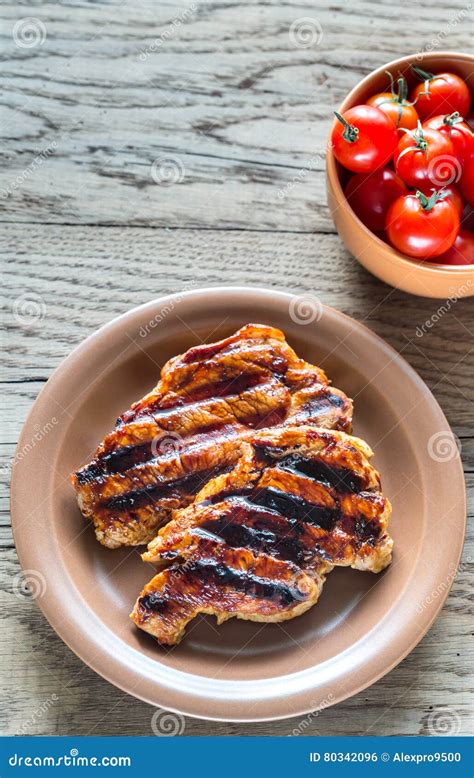 Bifes Grelhados Da Carne De Porco Na Placa Foto De Stock Imagem De