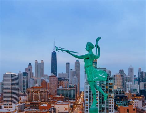 Spirit of Progress statue on Old Montgomery building. : r/chicago