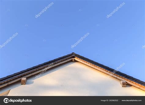 House Facade Gable Roof Pattern Blue Sky Stock Photo by ©YAYImages ...