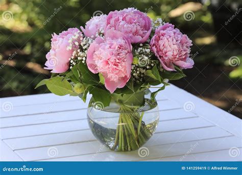 A Bunch Of Pink Peonies In A Glass Vase Stock Image Image Of