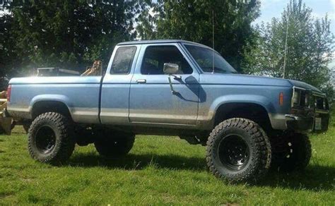 Blue Ford Ranger Truck on Lush Green Field