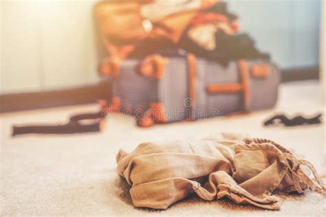 Open Suitcase Full Of Clothes In Room Stock Photo Image Of Home