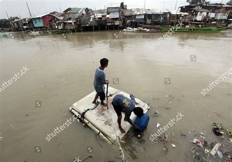 Filipino Residents Travel On Makeshift Raft Editorial Stock Photo